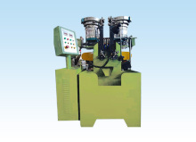 Screw head slotting machine