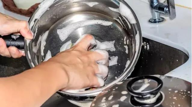 hand-wash your cookware with mild dish soap and warm water