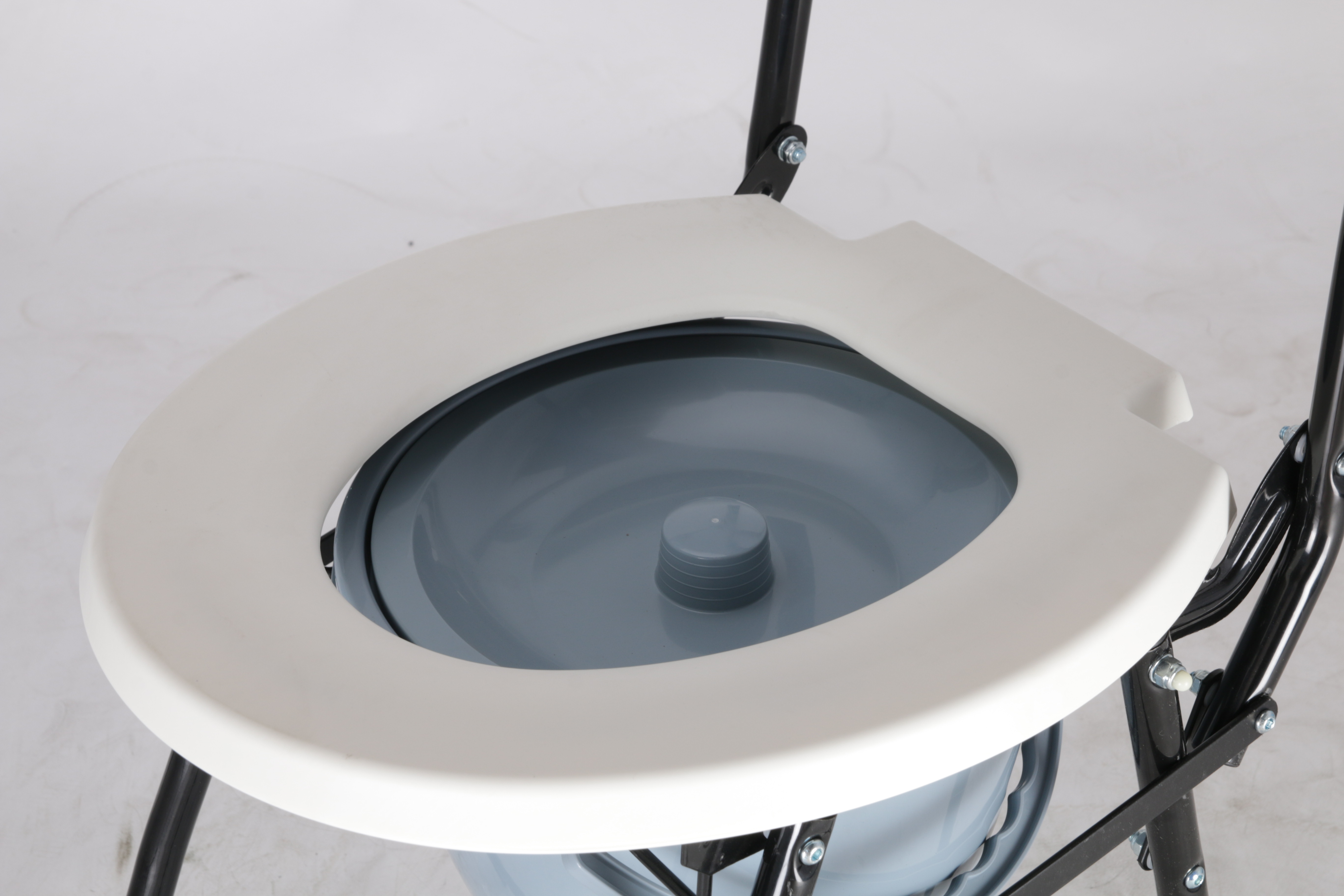 commode over toilet seat